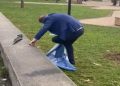 FOTOLAJM / The citizen wipes his shoes with the PD flag after the protest