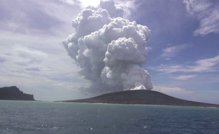 The eruption of the volcano in the Pacific and then the tsunami, sinking the boats in the harbor