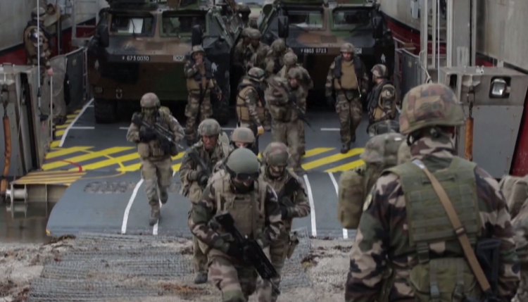 NATO takes control of US attack group, shows strength to Russia