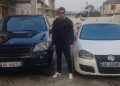 Photo shows / This is the 38-year-old who was shot several times with a firearm, posing near the “Benz” where he was injured