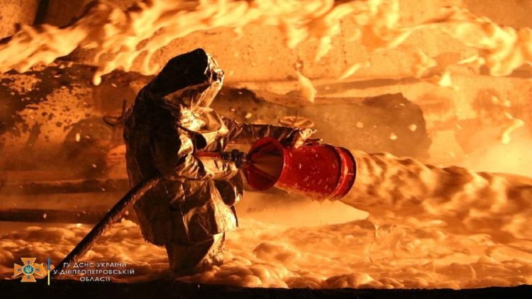 Photo / Firefighters fight fire at oil depot after Russian attack