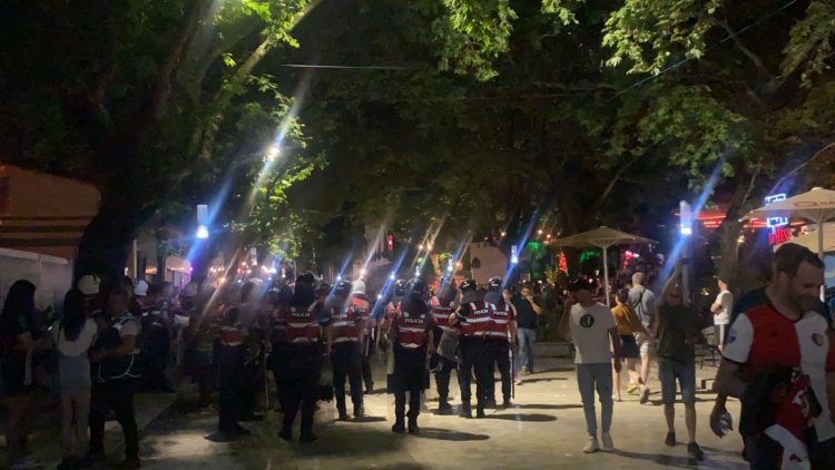 After the victory of Rome, Feneyord fans destroy the chairs on the sidewalk