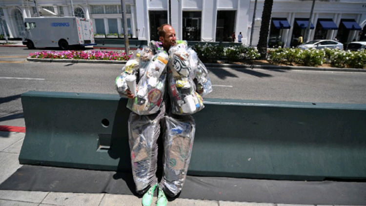 Using garbage as clothing, the American aims to make people aware