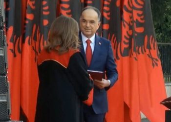 President Begaj is handed the Constitution by the President of the Constitutional Court
