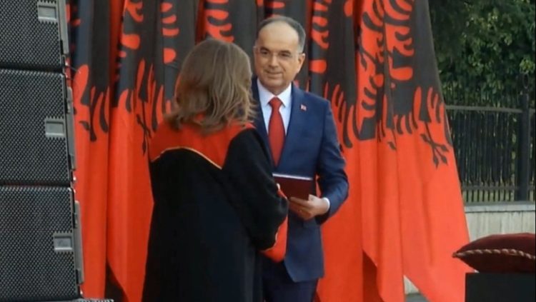 President Begaj is handed the Constitution by the President of the Constitutional Court