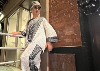 Covered in diamonds, Elton Ilirjani poses as a model on the streets of Manhattan