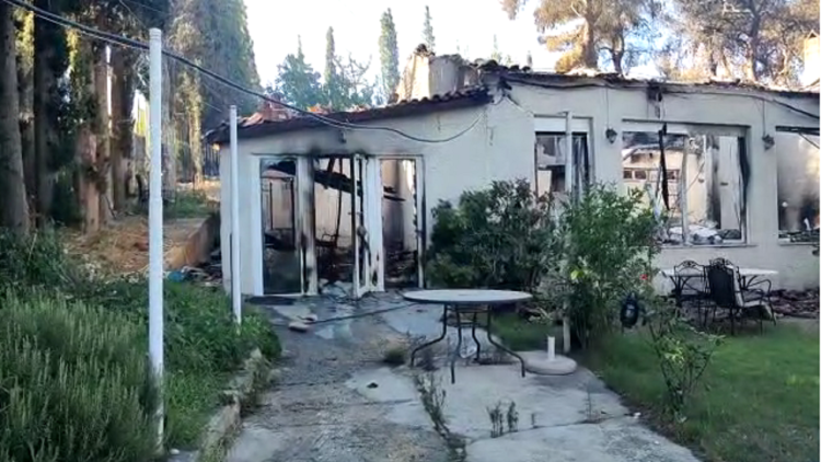 Battle with flames in Greece, view of burnt houses in several cities